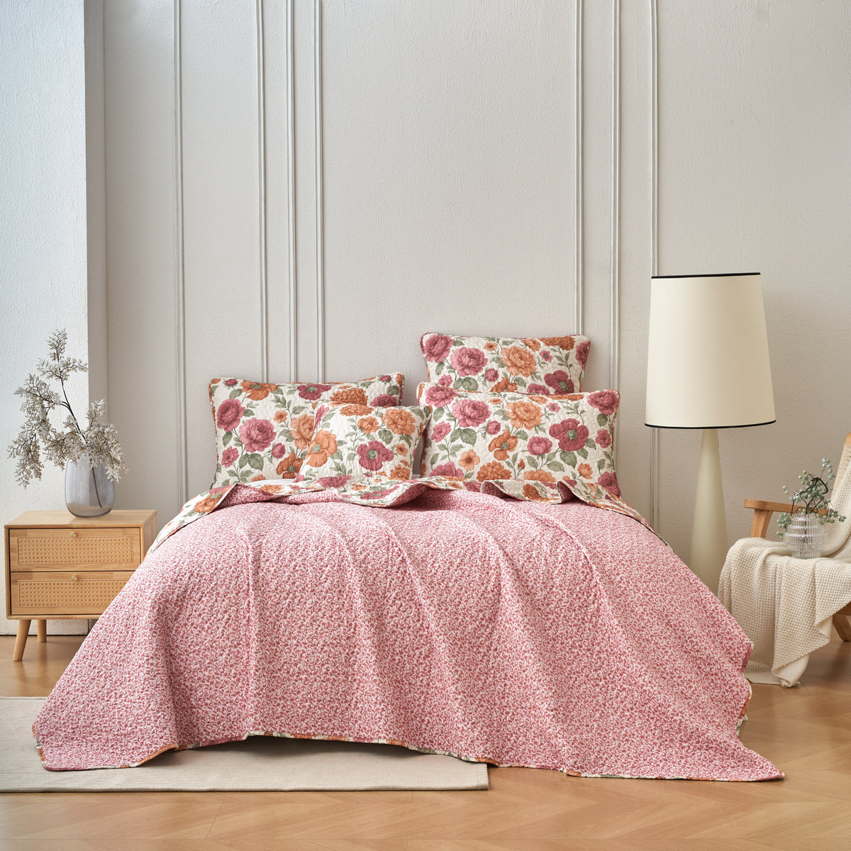 Reverse side of the quilt bedspread showing the coordinating rose and ivory scroll pattern
