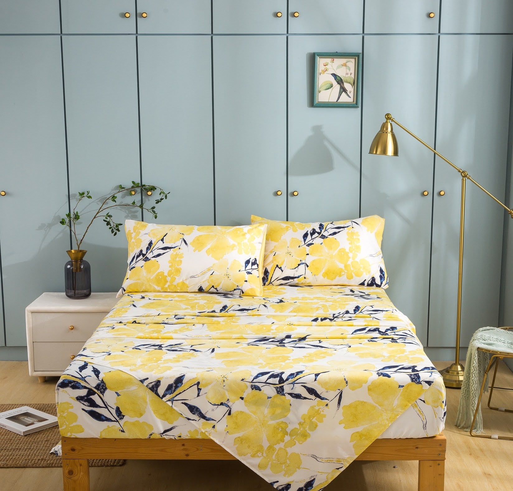 Buttercup bright yellow leaf pattern sheets on bed. click to view all bed sheets. light yellow blue floral leaves printed pattern print fitted flat to sheet. small business online shopping 