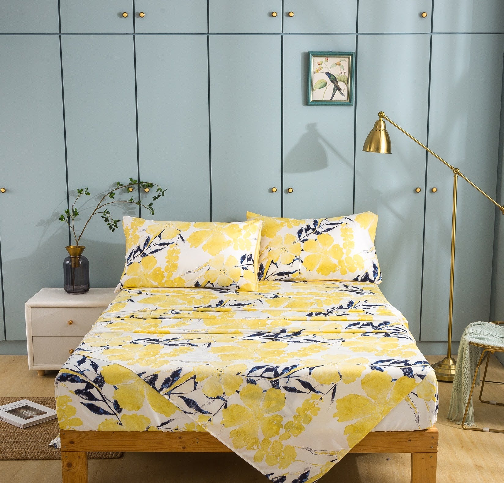 Buttercup bright yellow leaf pattern sheets on bed. click to view all bed sheets. light yellow blue floral leaves printed pattern print fitted flat to sheet. small business online shopping
