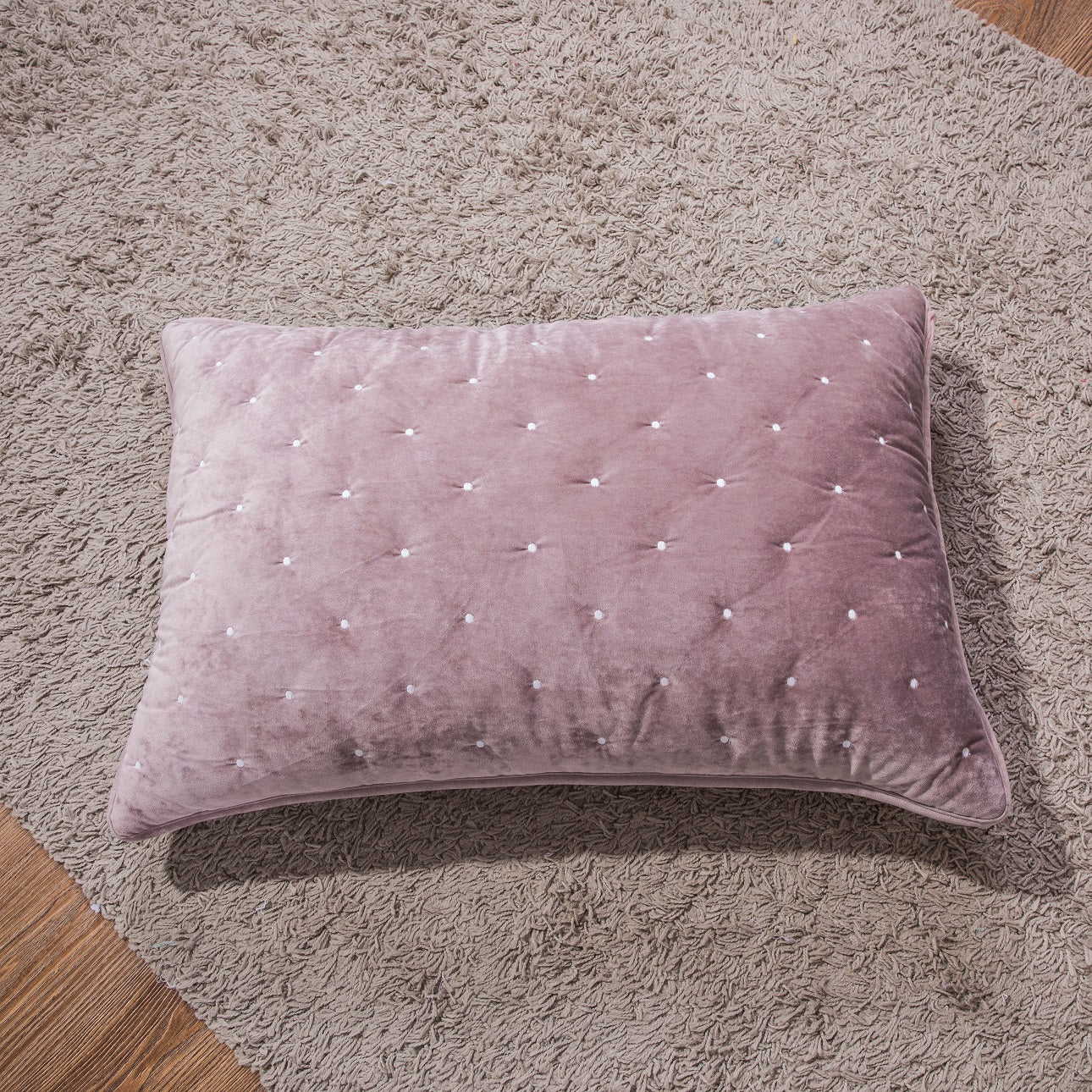 Tache Plush Dreams Purple Mauve Tufted Velvet Quilt Set Pink pillow with button details on a textured surface