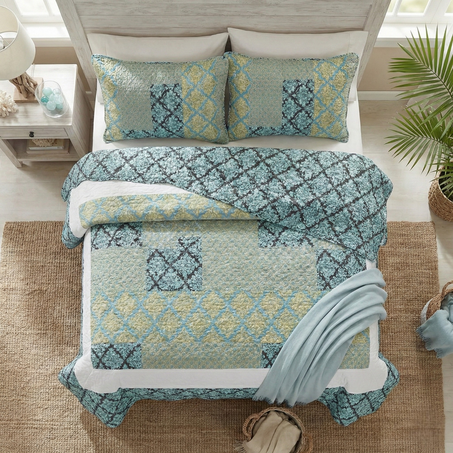 Tache Home Fashion bohemian teal and lime green damask bedspread set, featuring a reversible patchwork geometric quilt with scalloped edges and two matching shams on a bed
