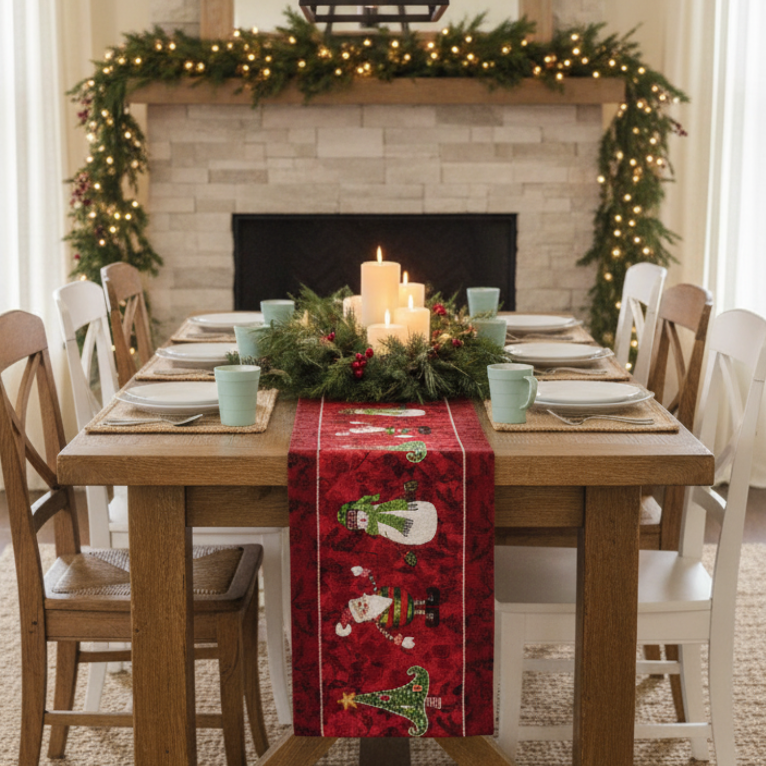 Dining room with a Christmas table setting in front of a fireplace decorated with garlands.