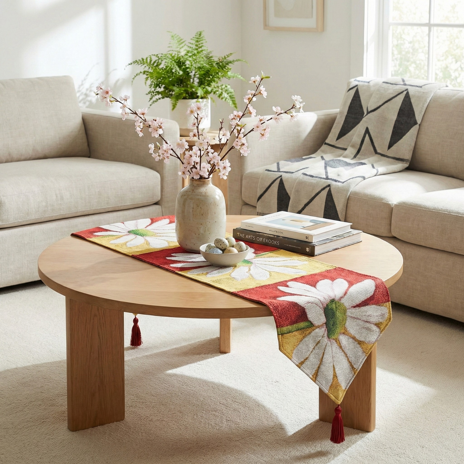 Living room with a wooden coffee table, floral arrangement and daisy flower red and yellow tapestry table runner
