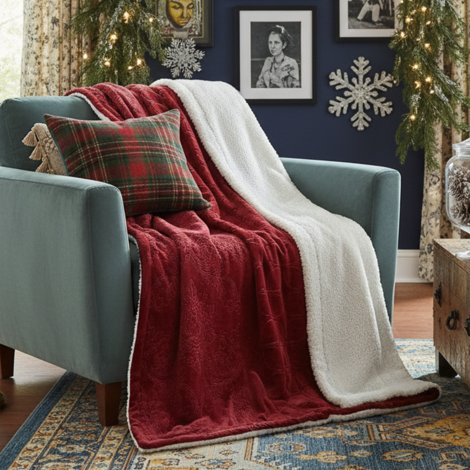 Blue armchair with a red blanket and plaid pillow in a decorated room.