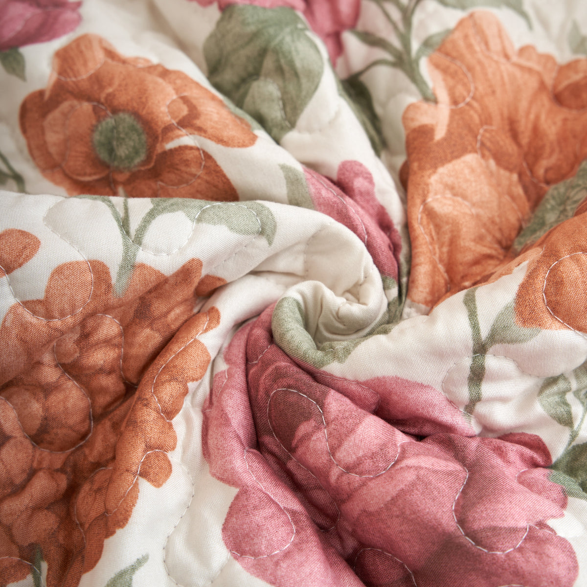 Reversible floral and scroll pattern detail on the terracotta rose garden quilted placemat