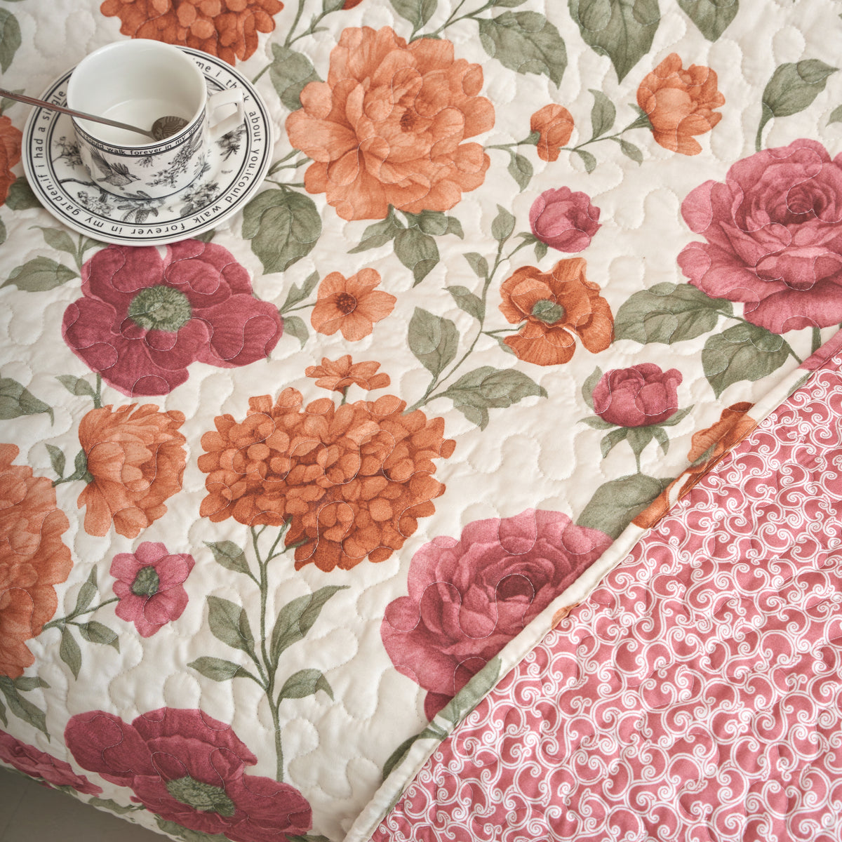 Tache Terracotta Rose Garden quilt bedspread set styled with matching shams in a sunlit bedroom