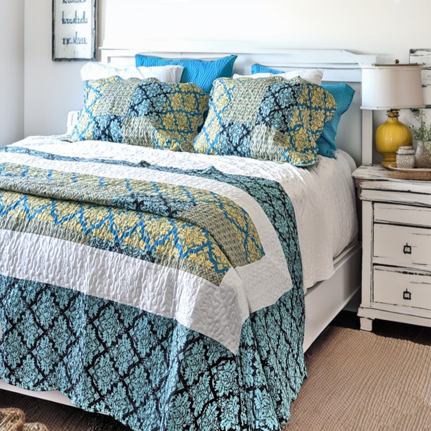 A quilt set with a damask pattern in teal, turquoise, and blue. The quilt is made of 100% polyester and has a scalloped edge. The set includes a quilt, two shams, and a bed skirt. The quilt is machine-washable and tumble-dryable.  The quilt set would be a great addition to any bedroom. The damask pattern is elegant and sophisticated, while the teal, turquoise, and blue colors are vibrant and inviting. The quilt set is also comfortable and cozy, making it perfect for a good night's sleep.