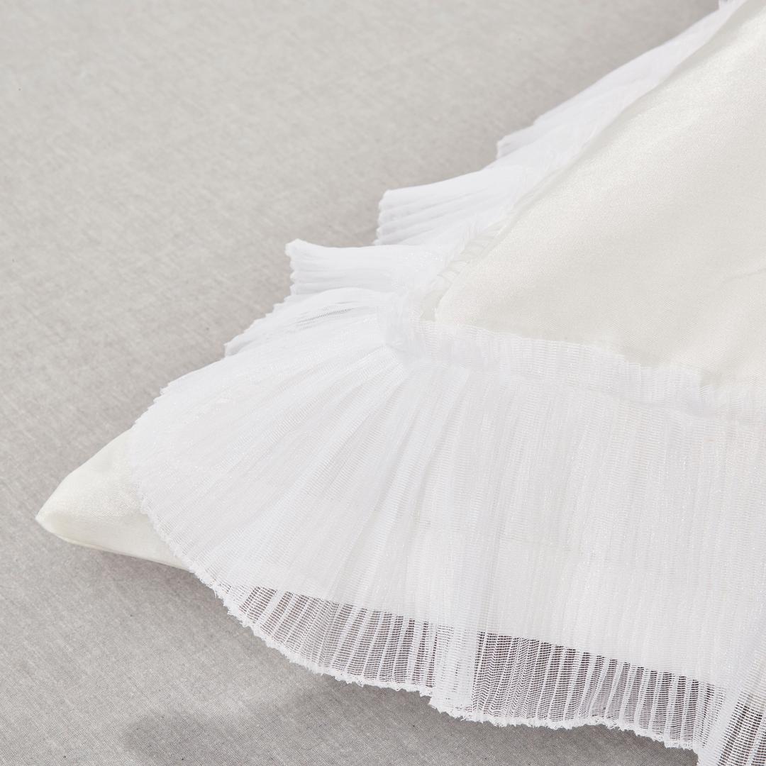 Close-up detail of the Tache Delicate Rose satin Euro sham showing ruffled edge and floral embellishment