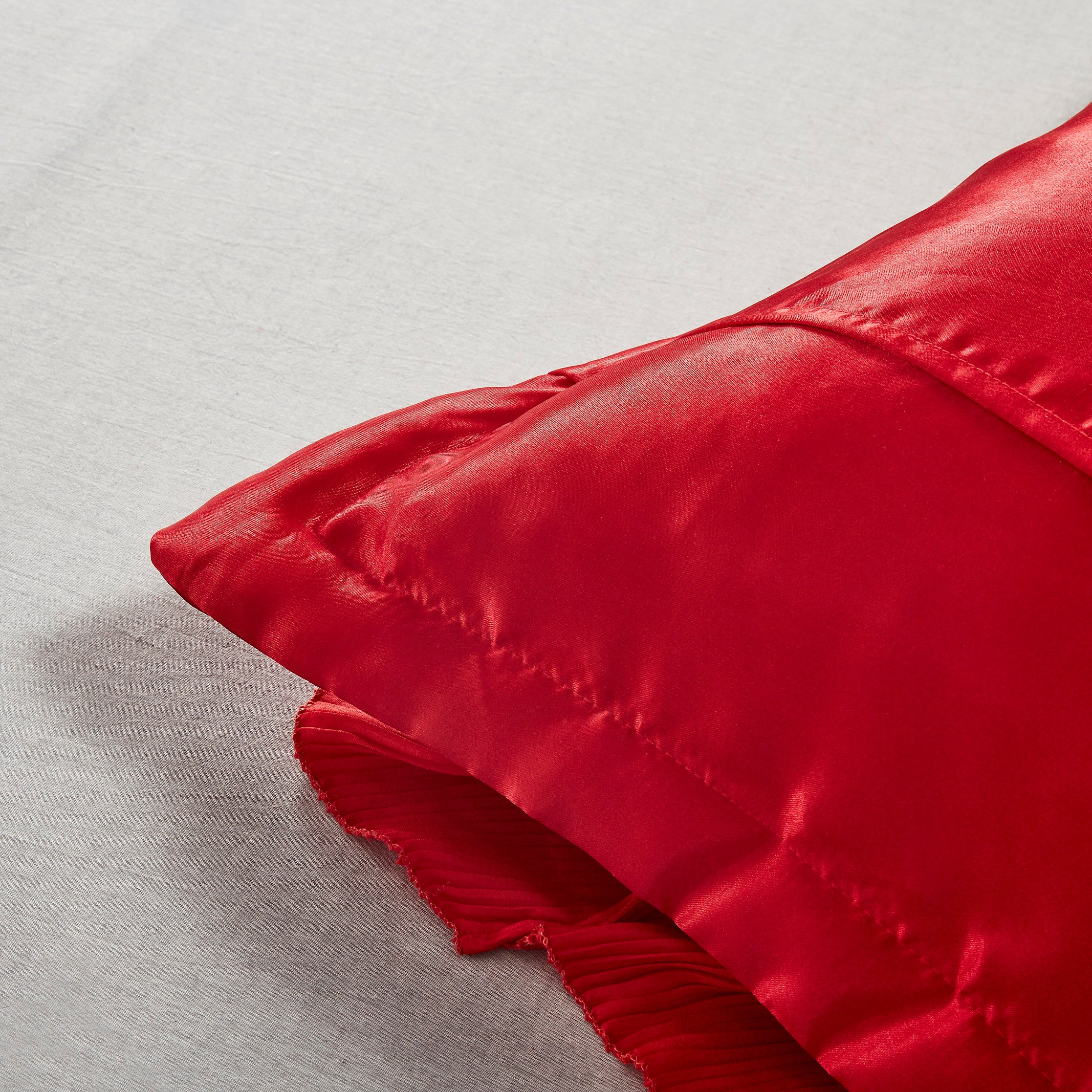 Tache Romantic Red Rose red satin Euro sham styled on a bed, HY4174